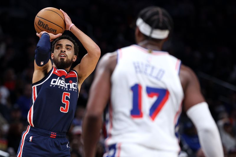 WASHINGTON, DC - FEBRUARY 10: Tyus Jones #5 of the Washington Wizards shoots against the Philadelphia 76ers during the first half at Capital One Arena on February 10, 2024 in Washington, DC. NOTE TO USER: User expressly acknowledges and agrees that, by downloading and or using this photograph, User is consenting to the terms and conditions of the Getty Images License Agreement.  (Photo by Patrick Smith/Getty Images)