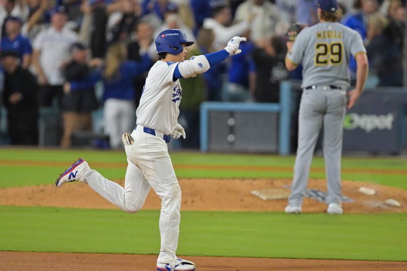 Oct 17, 2025; Los Angeles, California, USA; Los Angeles Dodgers two-way player Shohei Ohtani (17) reacts to his solo home run against the Milwaukee Brewers during the seventh inning of game four of the NLCS round for the 2025 MLB playoffs at Dodger Stadium. Mandatory Credit: Jayne Kamin-Oncea-Imagn Images