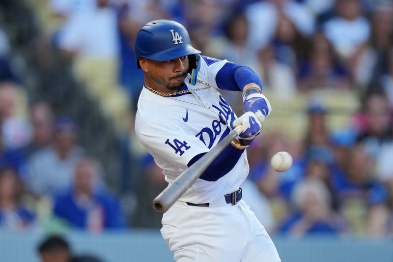Jun 15, 2024; Los Angeles, California, USA; Los Angeles Dodgers shortstop Mookie Betts (50) bats against the Kansas City Royals at Dodger Stadium. Mandatory Credit: Kirby Lee-USA TODAY Sports