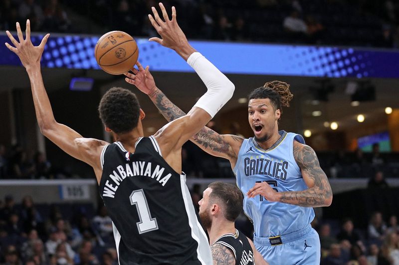 MEMPHIS, TENNESSEE - APRIL 09: Brandon Clarke #15 of the Memphis Grizzlies passes against Victor Wembanyama #1 of the San Antonio Spurs during the first half at FedExForum on April 09, 2024 in Memphis, Tennessee. NOTE TO USER: User expressly acknowledges and agrees that, by downloading and or using this photograph, User is consenting to the terms and conditions of the Getty Images License Agreement. (Photo by Justin Ford/Getty Images)