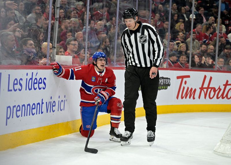 Mar 18, 2025; Montreal, Quebec, CAN; Montreal Canadiens forward Brendan Gallagher (11) and linesman Ryan Gibbons (58) during the second period of the game against the Ottawa Senators at the Bell Centre. Mandatory Credit: Eric Bolte-Imagn Images