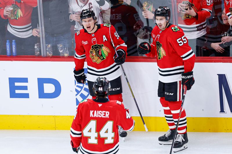 Nov 18, 2025; Chicago, Illinois, USA; Chicago Blackhawks center Connor Bedard (98) celebrates with teammates after scoring against the Calgary Flames during the third period at United Center. Mandatory Credit: Kamil Krzaczynski-Imagn Images