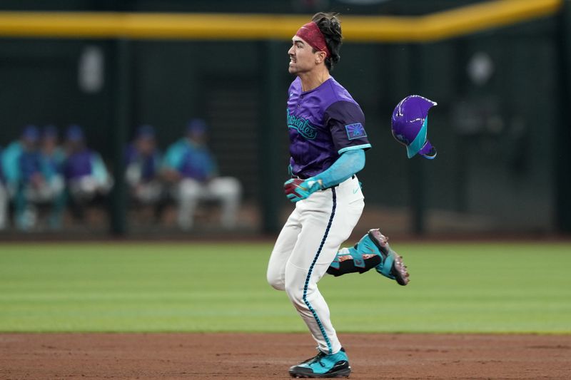 May 10, 2025; Phoenix, Arizona, USA; Arizona Diamondbacks outfielder Corbin Carroll (7) runs to third base en route to a triple against the Los Angeles Dodgers during the third inning at Chase Field. Mandatory Credit: Joe Camporeale-Imagn Images