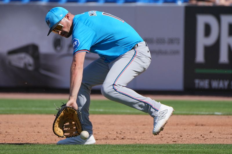 Feb 27, 2024; Port St. Lucie, Florida, USA;  Miami Marlins first baseman Trey Mancini (13) fields a ground ball that started a double play that ended the third inning at Clover Park. Mandatory Credit: Jim Rassol-USA TODAY Sports