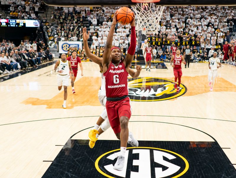 Jan 31, 2024; Columbia, Missouri, USA; Arkansas Razorbacks guard Layden Blocker (6) goes up for a dunk against Missouri Tigers forward Aidan Shaw (23) during the first half at Mizzou Arena. Mandatory Credit: Jay Biggerstaff-USA TODAY Sports