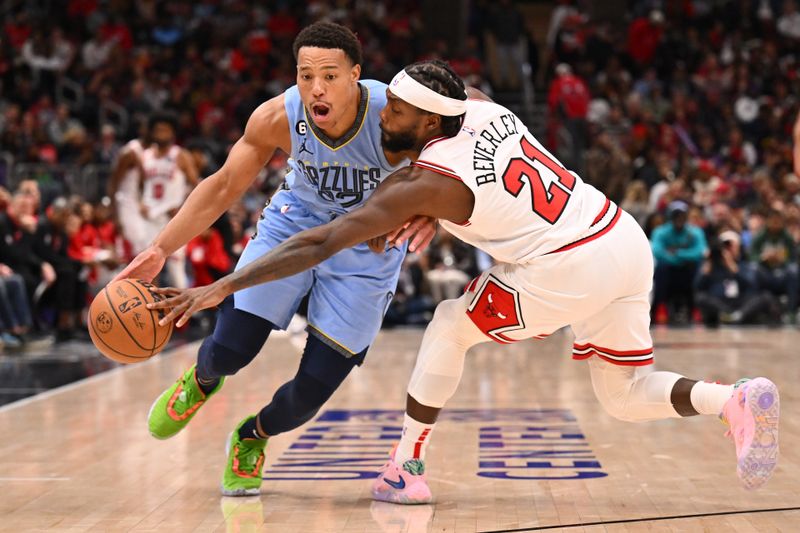 CHICAGO, ILLINOIS - APRIL 02:  Patrick Beverley #21 of the Chicago Bulls reaches in to knock the ball away from Desmond Bane #22 of the Memphis Grizzlies in the second half on April 02, 2023 at United Center in Chicago, Illinois. Chicago defeated Memphis 128-107.   NOTE TO USER: User expressly acknowledges and agrees that, by downloading and or using this photograph, User is consenting to the terms and conditions of the Getty Images License Agreement.  (Photo by Jamie Sabau/Getty Images)