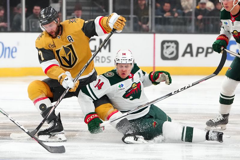 Feb 12, 2024; Las Vegas, Nevada, USA; Vegas Golden Knights defenseman Alex Pietrangelo (7) gains control of the puck from Minnesota Wild center Joel Eriksson Ek (14) during the first period at T-Mobile Arena. Mandatory Credit: Stephen R. Sylvanie-USA TODAY Sports