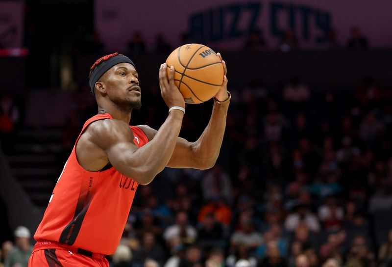 CHARLOTTE, NORTH CAROLINA - NOVEMBER 27: Jimmy Butler #22 of the Miami Heat attempts a jump shot during the second half of the game against the Charlotte Hornets at Spectrum Center on November 27, 2024 in Charlotte, North Carolina. NOTE TO USER: User expressly acknowledges and agrees that, by downloading and or using this photograph, User is consenting to the terms and conditions of the Getty Images License Agreement. (Photo by Jared C. Tilton/Getty Images)