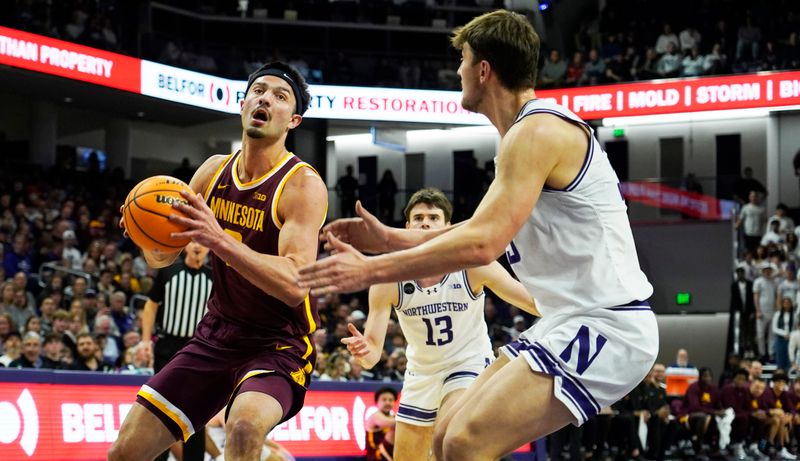 Mar 9, 2024; Evanston, Illinois, USA; Northwestern Wildcats forward Luke Hunger (33) defends Minnesota Golden Gophers forward Dawson Garcia (3) during the first half at Welsh-Ryan Arena. Mandatory Credit: David Banks-USA TODAY Sports