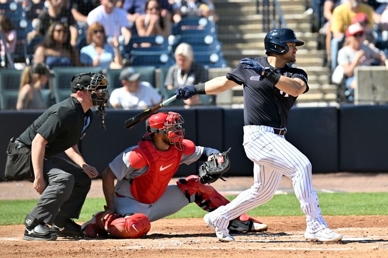 Feb 26, 2025; Tampa, Florida, USA;  New York Yankees left fielder Jasson Dominguez (24) hits a RBI single in the third inning  against the St. Louis Cardinals  during spring training  at George M. Steinbrenner Field. Mandatory Credit: Jonathan Dyer-Imagn Images