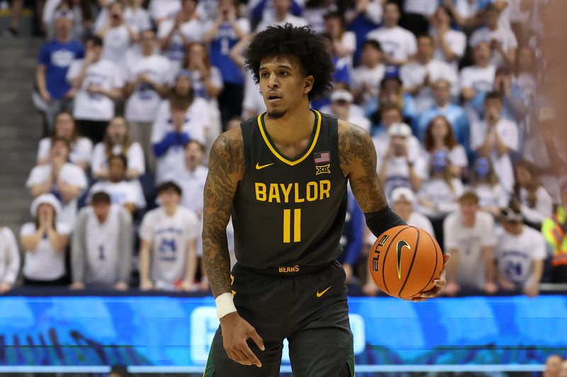 Feb 20, 2024; Provo, Utah, USA; Baylor Bears forward Jalen Bridges (11) looks to pass the ball against the Brigham Young Cougars during the first half at Marriott Center. Mandatory Credit: Rob Gray-USA TODAY Sports