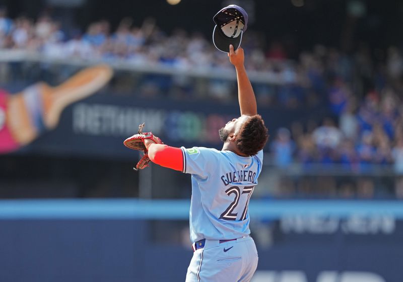 Aug 25, 2024; Toronto, Ontario, CAN; Toronto Blue Jays first base Vladimir Guerrero Jr. (27) celebrates the win against the Los Angeles Angels at the end of the ninth inning at Rogers Centre. Mandatory Credit: Nick Turchiaro-USA TODAY Sports