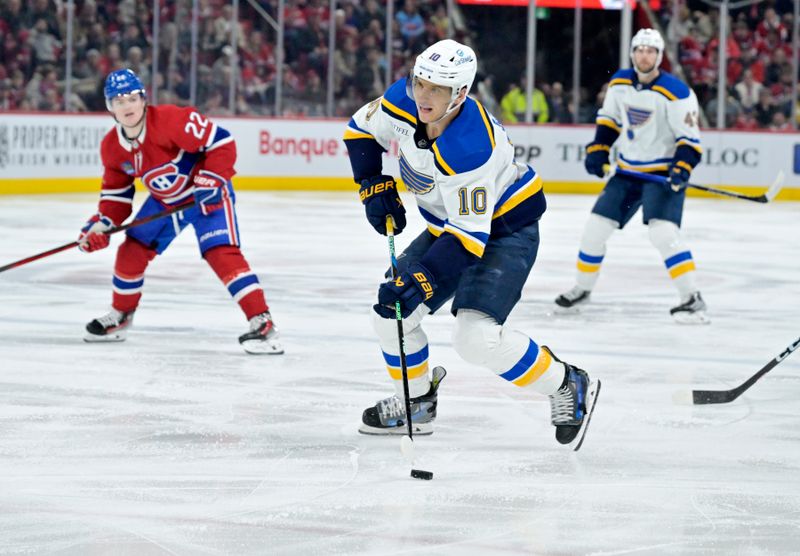 Feb 11, 2024; Montreal, Quebec, CAN; St.Louis Blues forward Brayden Schenn (10) plays the puck during the third period of the game against the Montreal Canadiens at the Bell Centre. Mandatory Credit: Eric Bolte-USA TODAY Sports