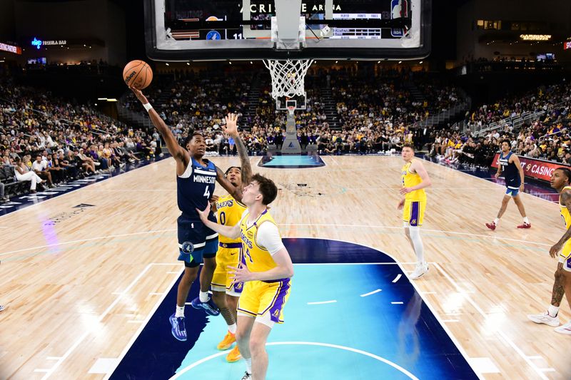 PALM SPRINGS, CA - OCTOBER 4:Rob Dillingham #4 of the Minnesota Timberwolves drives to the basket during the game against the Los Angeles Lakers  during an NBA preseason game on October 4, 2024 at Acrisure Arena in Palm Springs, California. NOTE TO USER: User expressly acknowledges and agrees that, by downloading and/or using this Photograph, user is consenting to the terms and conditions of the Getty Images License Agreement. Mandatory Copyright Notice: Copyright 2024 NBAE (Photo by Adam Pantozzi/NBAE via Getty Images)