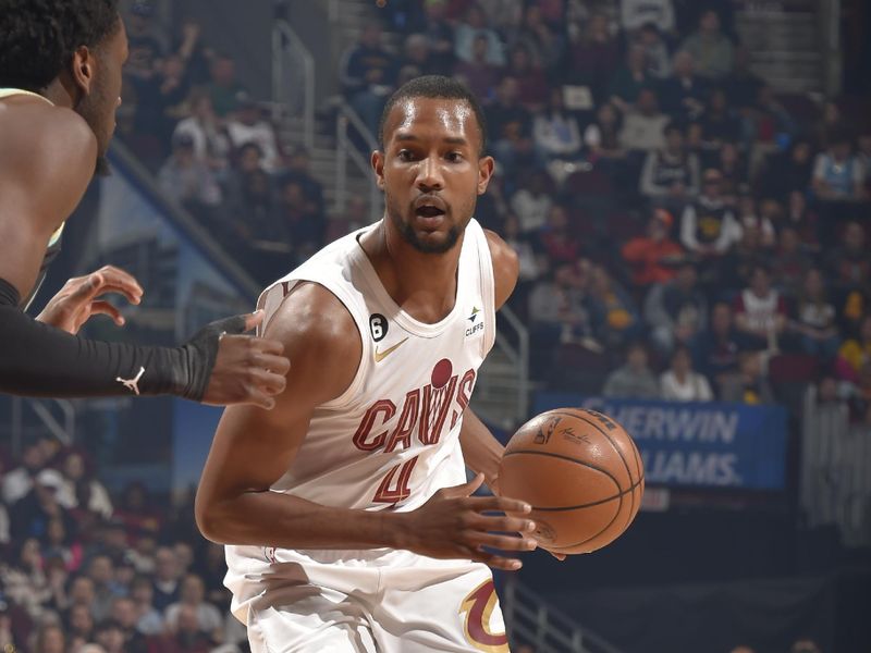 CLEVELAND, OH - APRIL 9: Evan Mobley #4 of the Cleveland Cavaliers handles the ball during the game against the Charlotte Hornets on April 9, 2023 at Rocket Mortgage FieldHouse in Cleveland, Ohio. NOTE TO USER: User expressly acknowledges and agrees that, by downloading and/or using this Photograph, user is consenting to the terms and conditions of the Getty Images License Agreement. Mandatory Copyright Notice: Copyright 2023 NBAE (Photo by David Liam Kyle/NBAE via Getty Images)