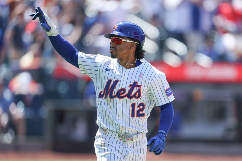May 11, 2025; New York City, New York, USA; New York Mets shortstop Francisco Lindor (12) looks back at the Mets dugout after hitting a solo home run during the eighth inning against the Chicago Cubs at Citi Field. Mandatory Credit: Vincent Carchietta-Imagn Images