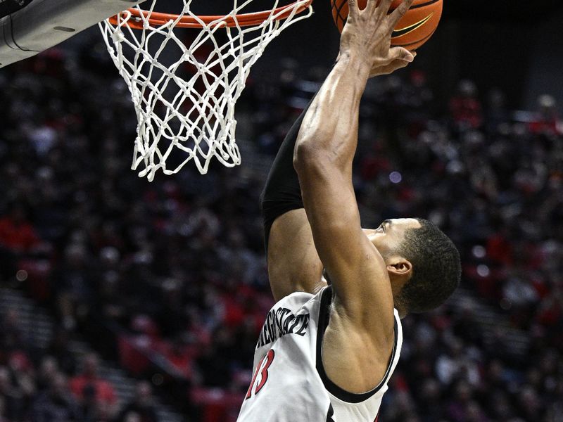 Jan 3, 2024; San Diego, California, USA; San Diego State forward Jaedon LeDee (13) goes to the basket during the first half against Fresno State at Viejas Arena. Mandatory Credit: Orlando Ramirez-USA TODAY Sports 