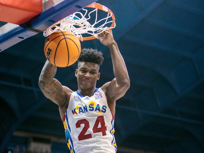 Feb 18, 2023; Lawrence, Kansas, USA; Kansas Jayhawks forward K.J. Adams Jr. (24) dunks against the Baylor Bears during the second half at Allen Fieldhouse. Mandatory Credit: William Purnell-USA TODAY Sports