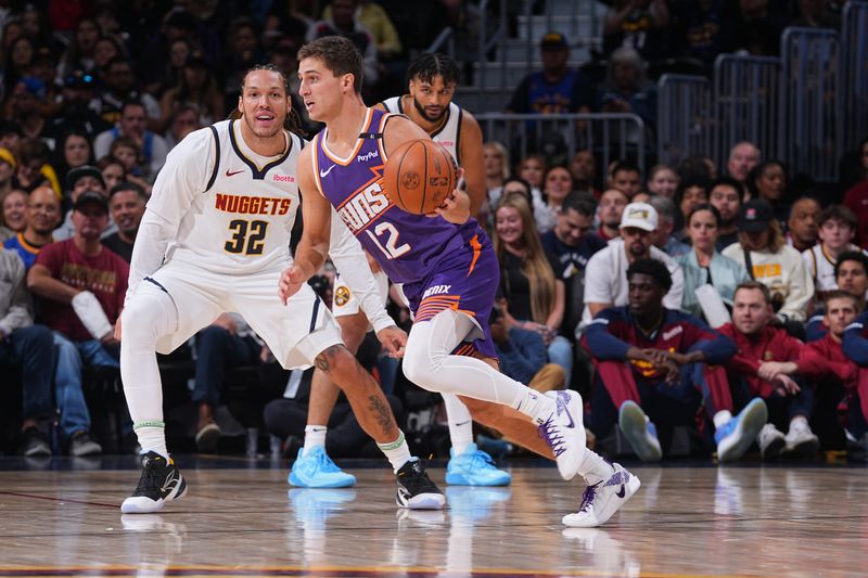 DENVER, CO - OCTOBER 13: Collin Gillespie #12 of the Phoenix Suns dribbles the ball during the game against the Denver Nuggets on October 13, 2024 at Ball Arena in Denver, Colorado. NOTE TO USER: User expressly acknowledges and agrees that, by downloading and/or using this Photograph, user is consenting to the terms and conditions of the Getty Images License Agreement. Mandatory Copyright Notice: Copyright 2024 NBAE (Photo by Bart Young/NBAE via Getty Images)