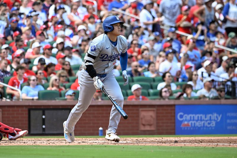 Aug 18, 2024; St. Louis, Missouri, USA; Los Angeles Dodgers designated hitter Shohei Ohtani (17) watches his solo home run against the St. Louis Cardinals in the fifth inning at Busch Stadium. Mandatory Credit: Joe Puetz-USA TODAY Sports