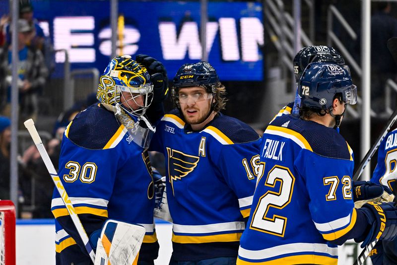 Nov 9, 2023; St. Louis, Missouri, USA;  St. Louis Blues center Robert Thomas (18) and goaltender Joel Hofer (30) celebrate after the Blues defeated the Arizona Coyotes at Enterprise Center. Mandatory Credit: Jeff Curry-USA TODAY Sports