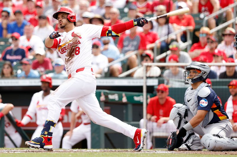 Mar 7, 2024; Jupiter, Florida, USA; St. Louis Cardinals second baseman Nolan Arenado (28) bats against the Houston Astros in the first inning at Roger Dean Chevrolet Stadium. Mandatory Credit: Rhona Wise-USA TODAY Sports