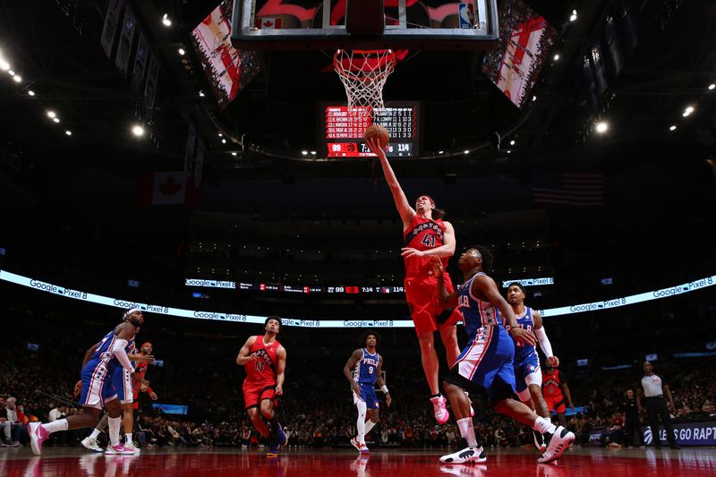 TORONTO, CANADA - MARCH 31: Kelly Olynyk #41 of the Toronto Raptor drives to the basket during the game against the Philadelphia 76ers on March 31, 2024 at the Scotiabank Arena in Toronto, Ontario, Canada.  NOTE TO USER: User expressly acknowledges and agrees that, by downloading and or using this Photograph, user is consenting to the terms and conditions of the Getty Images License Agreement.  Mandatory Copyright Notice: Copyright 2024 NBAE (Photo by Vaughn Ridley/NBAE via Getty Images)