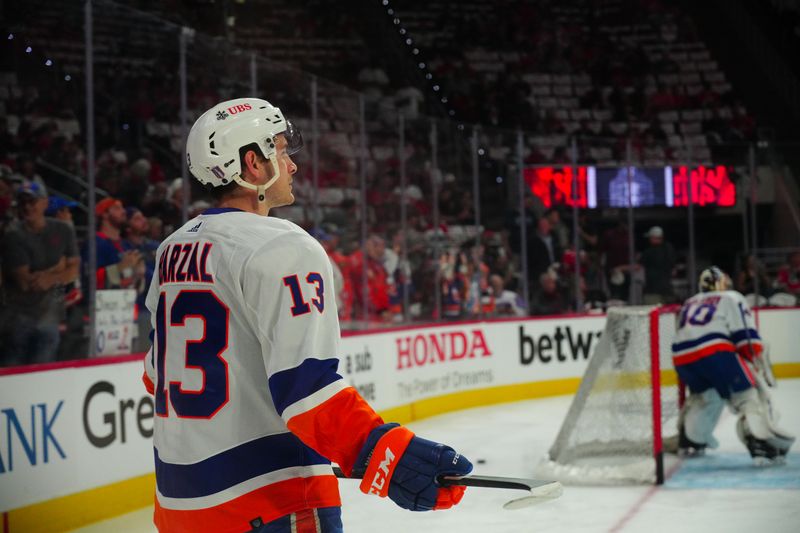 Apr 20, 2024; Raleigh, North Carolina, USA; New York Islanders center Mathew Barzal (13) looks on before the game during the warmups against the Carolina Hurricanes in game one of the first round of the 2024 Stanley Cup Playoffs at PNC Arena. Mandatory Credit: James Guillory-USA TODAY Sports