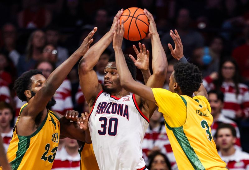 Nov 29, 2025; Tucson, Arizona, USA; Arizona Wildcats forward Tobe Awaka (30) looks to pass against three Norfolk State Spartans players during the first half at McKale Memorial Center. Mandatory Credit: Aryanna Frank-Imagn Images