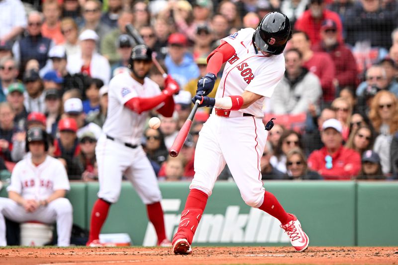 May 25, 2025; Boston, Massachusetts, USA; Boston Red Sox shortstop Marcelo Mayer (39) hits a single against the Baltimore Orioles for his first MLB hit during the second inning at Fenway Park. Mandatory Credit: Brian Fluharty-Imagn Images