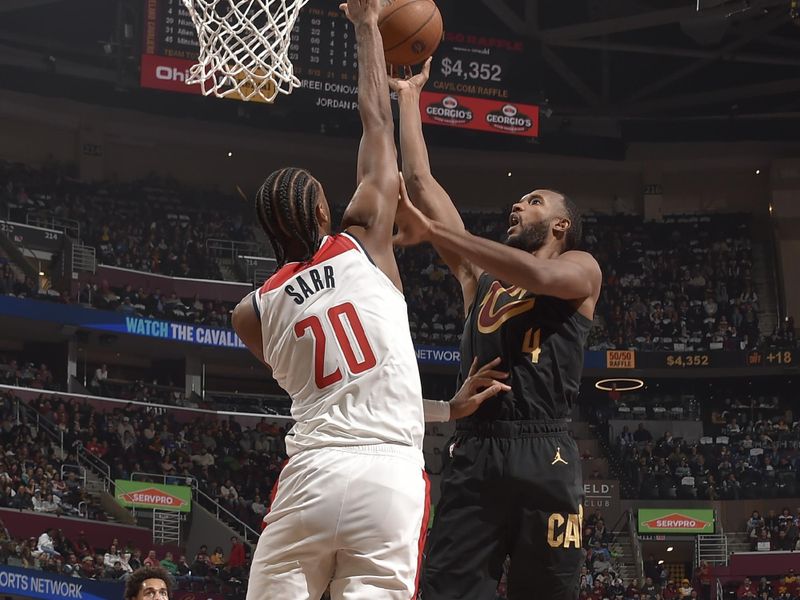 CLEVELAND, OH - NOVEMBER 03: Evan Mobley #4 of the Cleveland Cavaliers shoots the ball during the game against the Washington Wizards during the Emirates NBA Cup game on November 03, 2024 at Rocket Mortgage FieldHouse in Cleveland, Ohio. NOTE TO USER: User expressly acknowledges and agrees that, by downloading and/or using this Photograph, user is consenting to the terms and conditions of the Getty Images License Agreement. Mandatory Copyright Notice: Copyright 2024 NBAE (Photo by David Liam Kyle/NBAE via Getty Images)