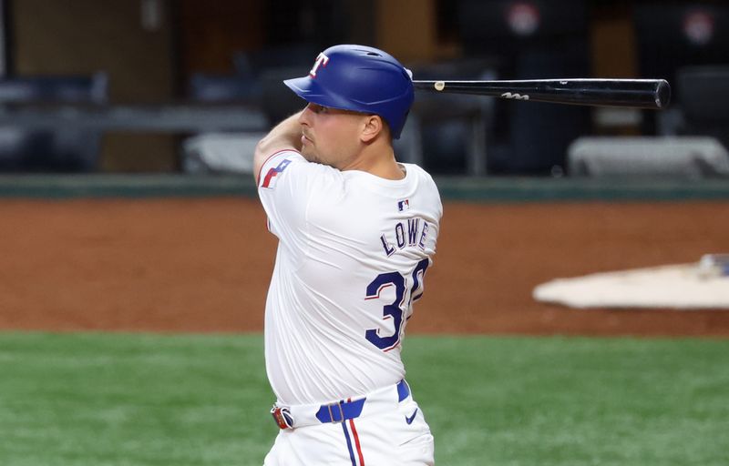 Jul 2, 2024; Arlington, Texas, USA;  Texas Rangers first baseman Nathaniel Lowe (30) hits a two-run home run during the third inning against the San Diego Padres at Globe Life Field. Mandatory Credit: Kevin Jairaj-USA TODAY Sports