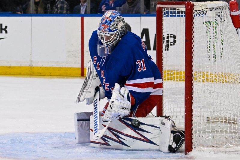 Jan 21, 2025; New York, New York, USA;  New York Rangers goaltender Igor Shesterkin (31) makes a save against the Ottawa Senators during the third period at Madison Square Garden. Mandatory Credit: Dennis Schneidler-Imagn Images