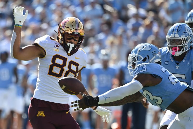 Sep 16, 2023; Chapel Hill, North Carolina, USA; North Carolina Tar Heels linebacker Power Echols (23) intercepts the ball as Minnesota Golden Gophers tight end Brevyn Spann-Ford (88) is in the background in the first quarter at Kenan Memorial Stadium. Mandatory Credit: Bob Donnan-USA TODAY Sports