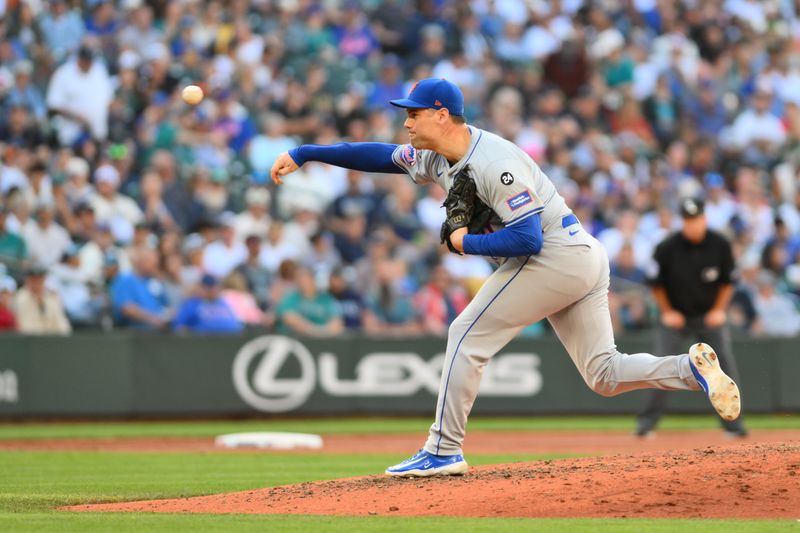 Aug 11, 2024; Seattle, Washington, USA; New York Mets relief pitcher Adam Ottavino (0) pitches to the Seattle Mariners during the sixth inning at T-Mobile Park. Mandatory Credit: Steven Bisig-USA TODAY Sports