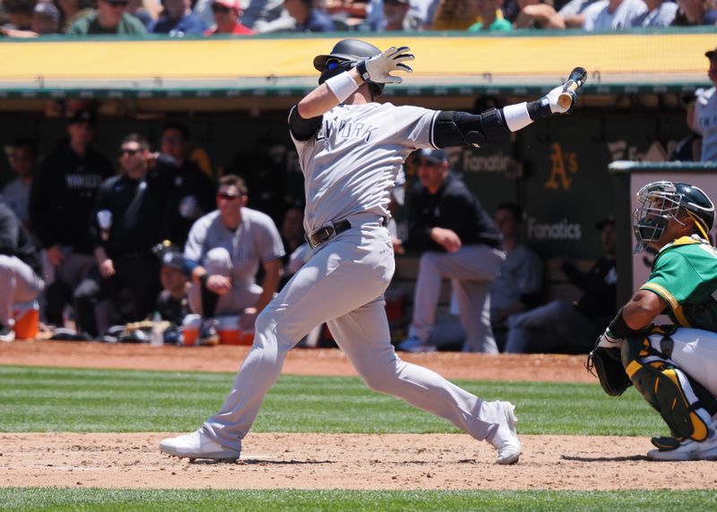 Jun 29, 2023; Oakland, California, USA; New York Yankees third baseman Josh Donaldson (28) hits a two-run home run against the Oakland Athletics during the sixth inning at Oakland-Alameda County Coliseum. Mandatory Credit: Kelley L Cox-USA TODAY Sports