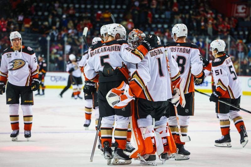 Apr 2, 2024; Calgary, Alberta, CAN; Anaheim Ducks goaltender Lukas Dostal (1) celebrate win with teammates after defeating the Calgary Flames during the third period at Scotiabank Saddledome. Mandatory Credit: Sergei Belski-USA TODAY Sports