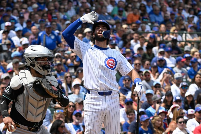 Jul 21, 2024; Chicago, Illinois, USA;  Chicago Cubs second base Nico Hoerner (2) reacts after striking out during the third inning against the Arizona Diamondbacks] at Wrigley Field. Mandatory Credit: Matt Marton-USA TODAY Sports