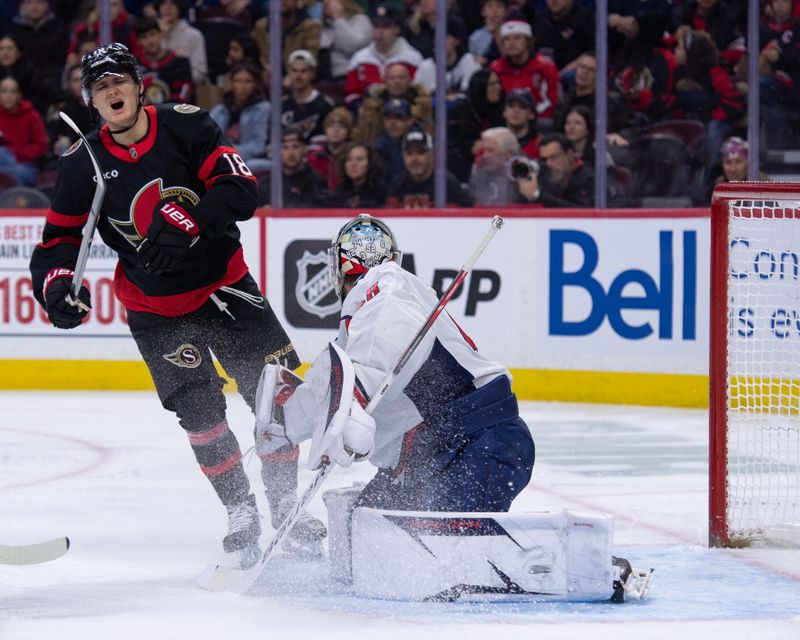 Jan 1, 2026; Ottawa, Ontario, CAN; Ottawa Senators center Tim Stutzle (18) reacts after getting hit by the puck while screening Washington Capitals goalie Logan Thompson (48) in the first period at the Canadian Tire Centre. Mandatory Credit: Marc DesRosiers-IMAGN Images
