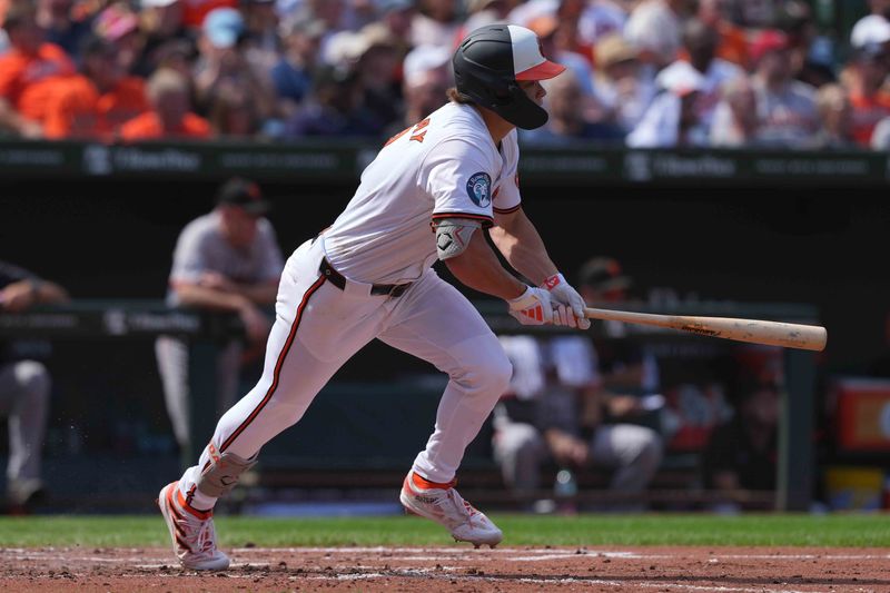 Sep 19, 2024; Baltimore, Maryland, USA; Baltimore Orioles second baseman Jackson Holliday (7) drives in two runs on his fourth inning double against the San Francisco Giants at Oriole Park at Camden Yards. Mandatory Credit: Mitch Stringer-Imagn Images