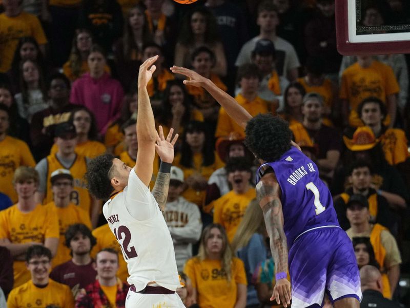 Feb 22, 2024; Tempe, Arizona, USA; Arizona State Sun Devils guard Jose Perez (12) shoots over Washington Huskies forward Keion Brooks Jr. (1) during the first half at Desert Financial Arena. Mandatory Credit: Joe Camporeale-USA TODAY Sports