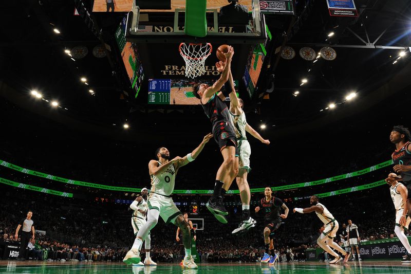 BOSTON, MA - FEBRUARY 9: Corey Kispert #24 of the Washington Wizards drives to the basket during the game against the Boston Celtics on February 9, 2024 at the TD Garden in Boston, Massachusetts. NOTE TO USER: User expressly acknowledges and agrees that, by downloading and or using this photograph, User is consenting to the terms and conditions of the Getty Images License Agreement. Mandatory Copyright Notice: Copyright 2024 NBAE  (Photo by Brian Babineau/NBAE via Getty Images)