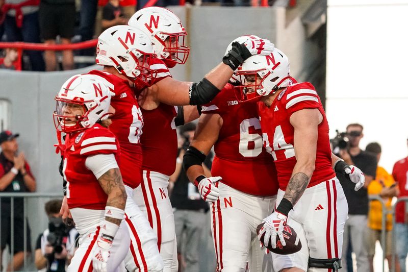 Sep 16, 2023; Lincoln, Nebraska, USA; Nebraska Cornhuskers tight end Thomas Fidone II (24) celebrates with teammates after scoring against the Northern Illinois Huskies during the second quarter at Memorial Stadium. Mandatory Credit: Dylan Widger-USA TODAY Sports