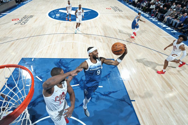 MINNEAPOLIS, MN -  MARCH 22: Nickeil Alexander-Walker #9 of the Minnesota Timberwolves rebounds during the game against the Cleveland Cavaliers on March 22, 2024 at Target Center in Minneapolis, Minnesota. NOTE TO USER: User expressly acknowledges and agrees that, by downloading and or using this Photograph, user is consenting to the terms and conditions of the Getty Images License Agreement. Mandatory Copyright Notice: Copyright 2024 NBAE (Photo by David Sherman/NBAE via Getty Images)