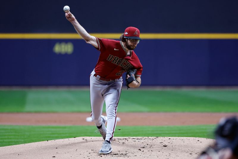 Oct 4, 2023; Milwaukee, Wisconsin, USA; Arizona Diamondbacks starting pitcher Zac Gallen (23) pitches against the Milwaukee Brewers in the first inning during game two of the Wildcard series for the 2023 MLB playoffs at American Family Field. Mandatory Credit: Kamil Krzaczynski-USA TODAY Sports