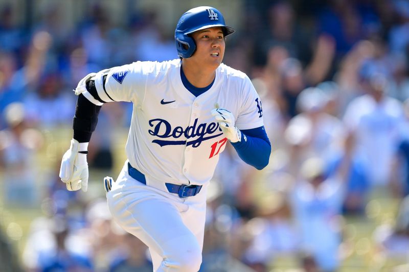 Jul 25, 2024; Los Angeles, California, USA; Los Angeles Dodgers designated hitter Shohei Ohtani (17) runs after hitting a solo home run against the San Francisco Giants during the eighth inning at Dodger Stadium. Mandatory Credit: Gary A. Vasquez-USA TODAY Sports