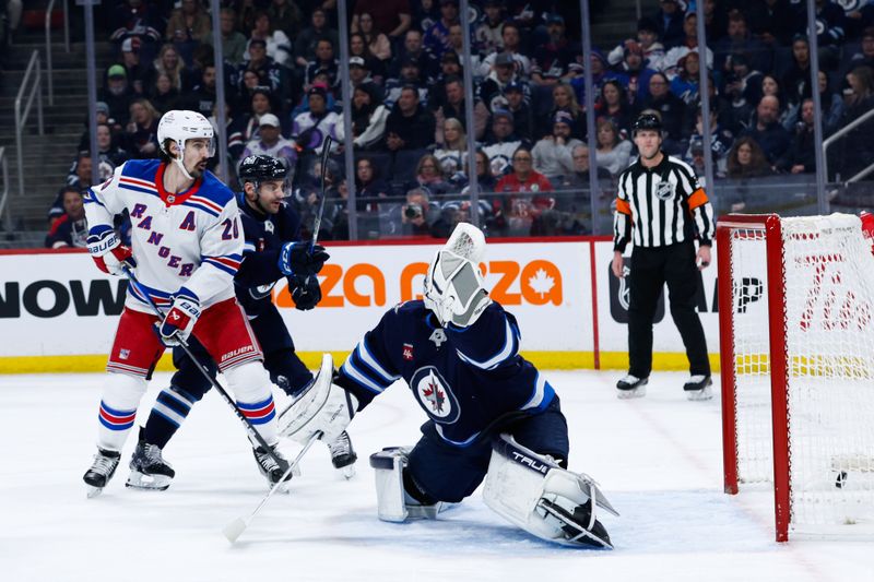 Mar 11, 2025; Winnipeg, Manitoba, CAN;  New York Rangers forward Mika Zibanejad (93) (not shown) scores on Winnipeg Jets goalie Connor Hellebuyck (37) during the first period at Canada Life Centre. Mandatory Credit: Terrence Lee-Imagn Images