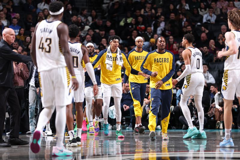 BROOKLYN, NY - DECEMBER 4: Enrique Freeman #8 of the Indiana Pacers high fives teammates during the game against the Brooklyn Nets on December 4, 2024 at Barclays Center in Brooklyn, New York. NOTE TO USER: User expressly acknowledges and agrees that, by downloading and or using this Photograph, user is consenting to the terms and conditions of the Getty Images License Agreement. Mandatory Copyright Notice: Copyright 2024 NBAE (Photo by Jeff Haynes/NBAE via Getty Images)