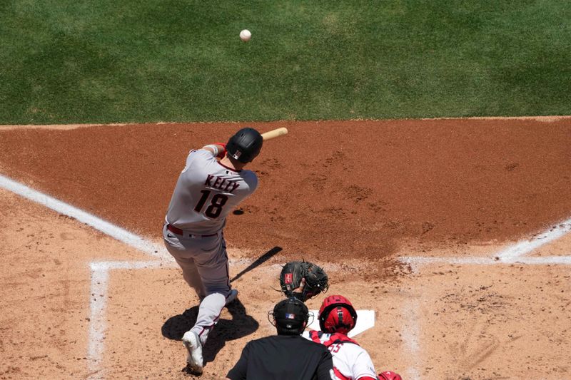 Jul 2, 2023; Anaheim, California, USA; Arizona Diamondbacks catcher Carson Kelly (18) hits a two-run home run in the second inning against the Los Angeles Angels at Angel Stadium. Mandatory Credit: Kirby Lee-USA TODAY Sports