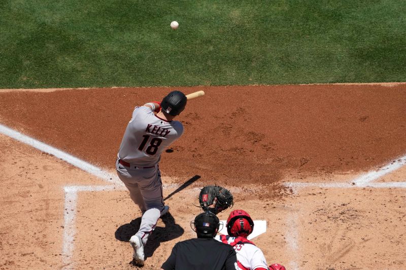 Jul 2, 2023; Anaheim, California, USA; Arizona Diamondbacks catcher Carson Kelly (18) hits a two-run home run in the second inning against the Los Angeles Angels at Angel Stadium. Mandatory Credit: Kirby Lee-USA TODAY Sports